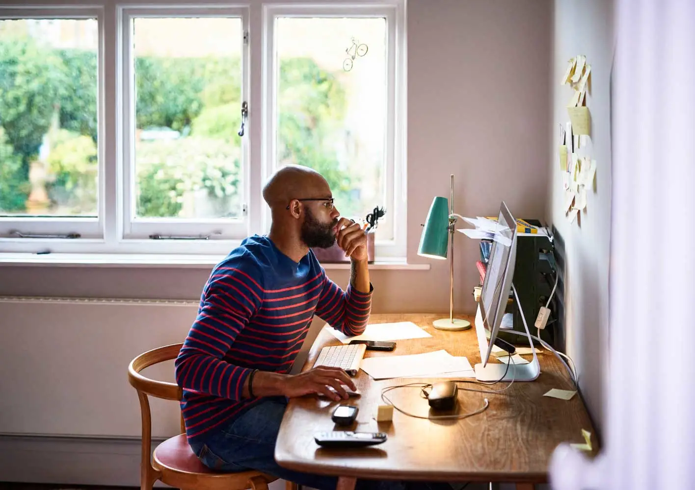 Man using computer in home office