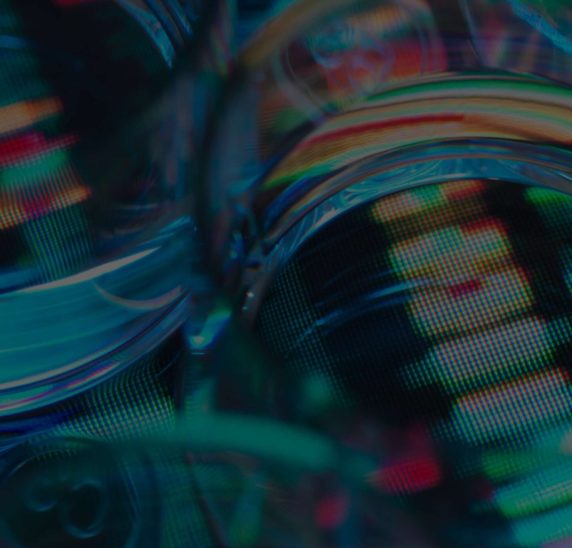 A close-up of several petri dishes on top of a multi-colored background