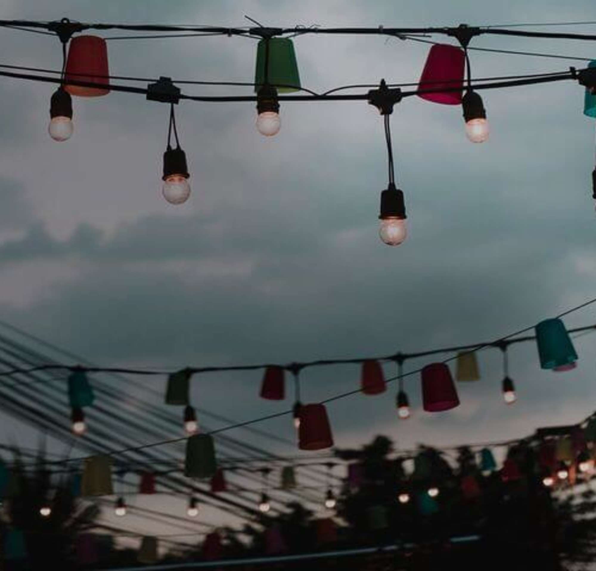 Party lights hanging over the patio of restaurant.