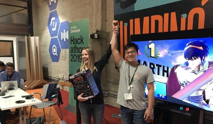 DocuSign's Caly Moss congratulates the winner of the Super Smash Bros tournament