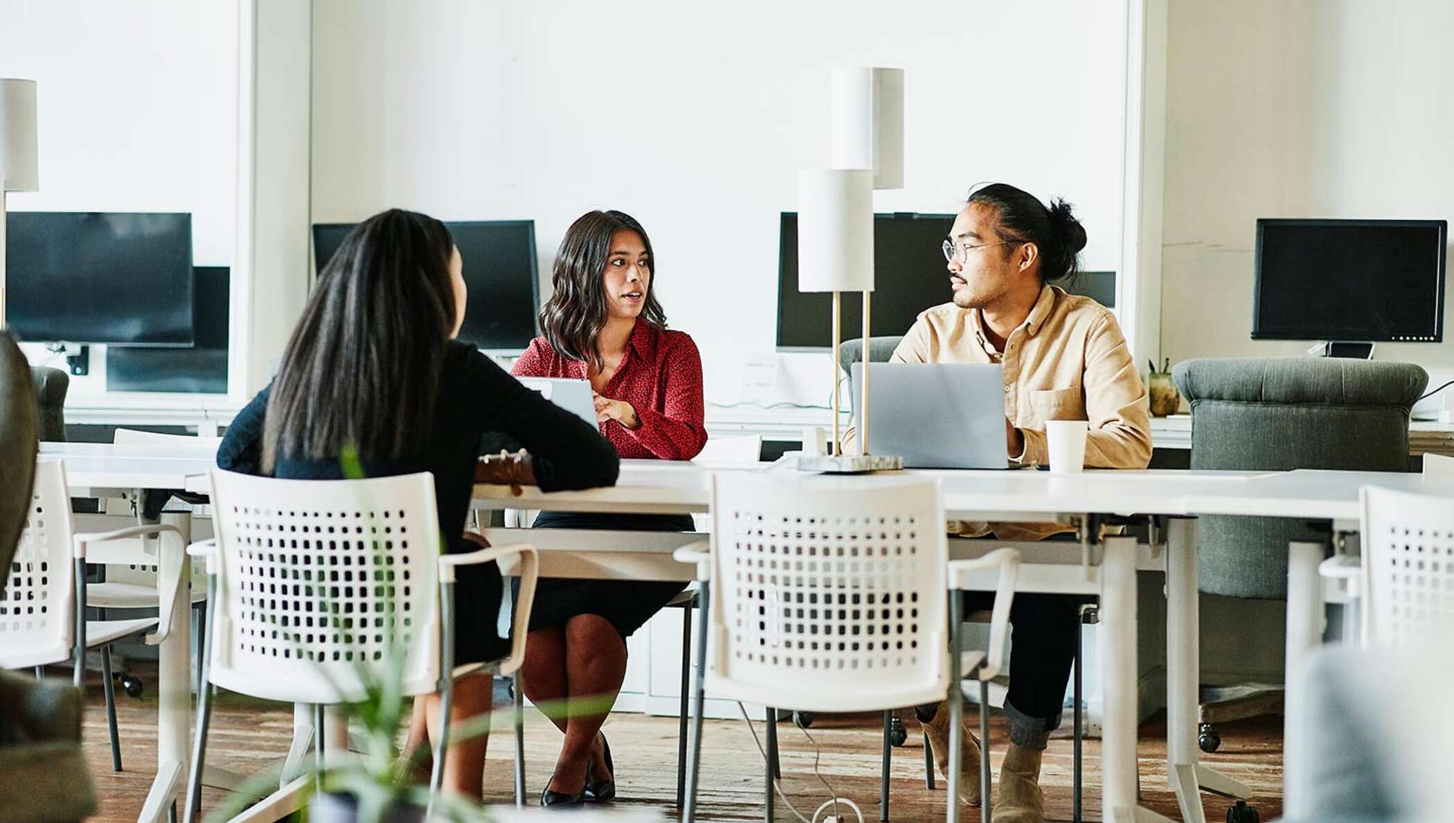 Insurance carrier image Business colleagues in discussion while working together in office