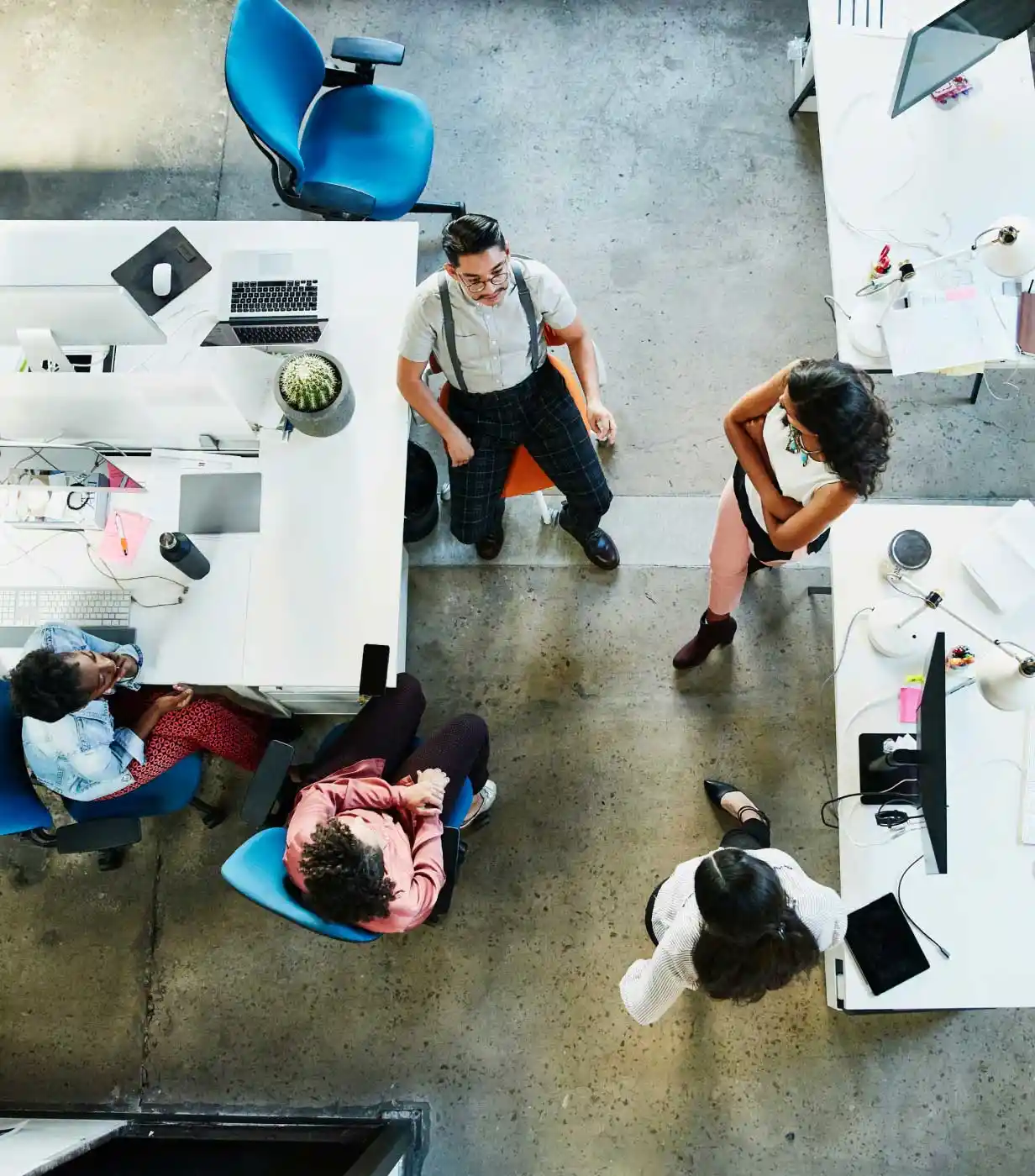 Overhead view of design team having project meeting in office