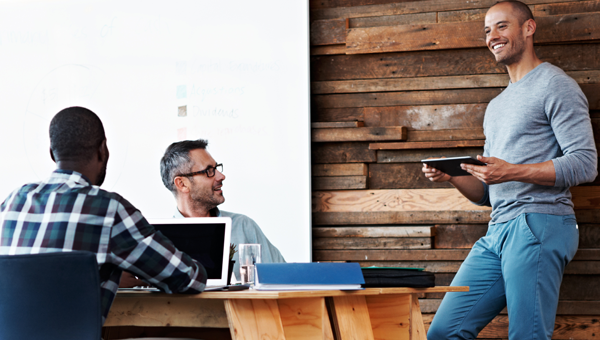 Casual people working in a modern conference room.