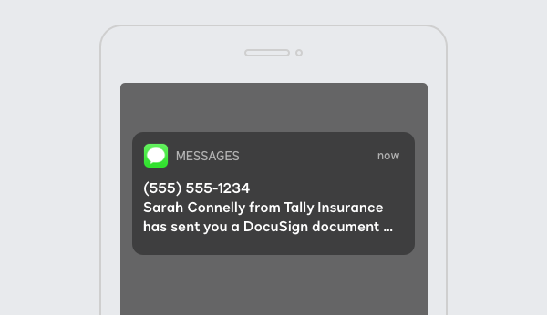 A cellphone with a text notification from DocuSign eSignature SMS Delivery.